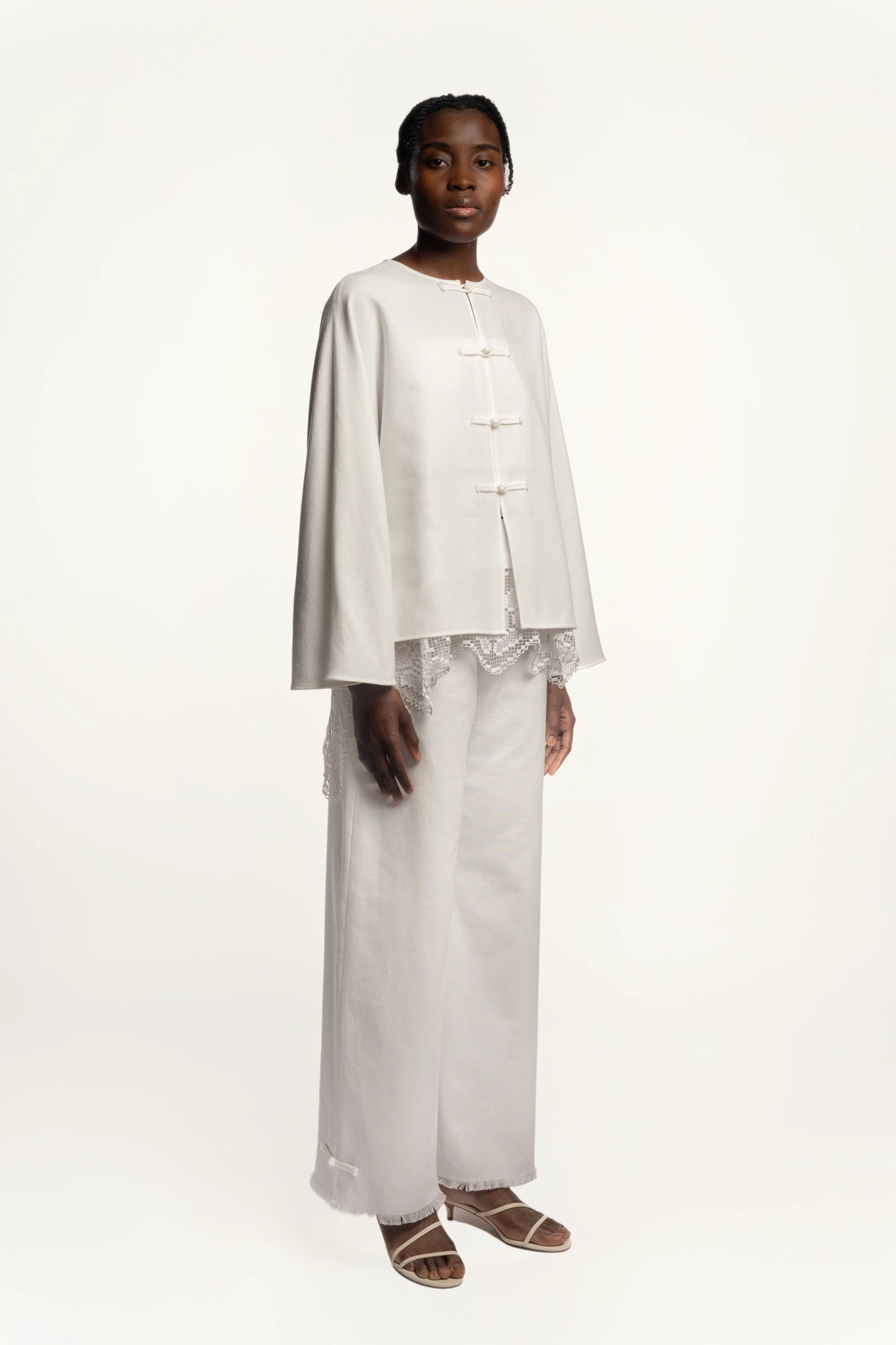 Cruise Trousers | MAISON MAGDALNEA | White cotton trousers with a handmade frog button as decoration at the bottom | Full model picture styled with Cruise Top