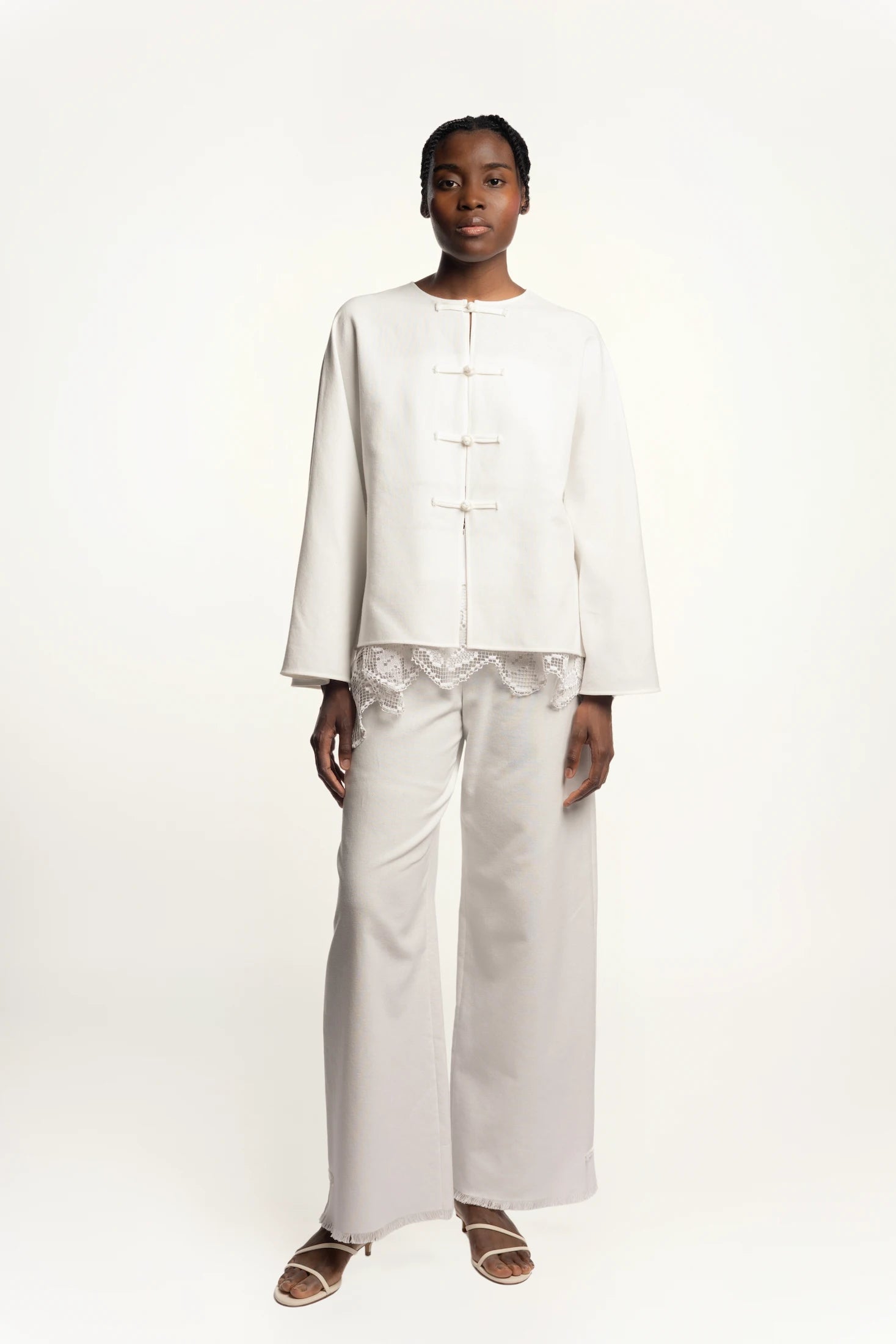 Cruise Top | Cruise Trousers | MAISON MAGDALENA | White top with handmade frog buttons | Model picture full body front view