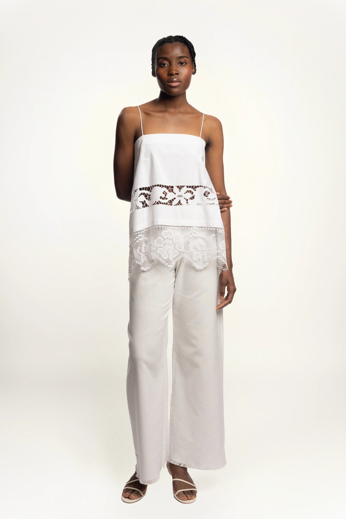 Cruise Trousers | MAISON MAGDALNEA | White cotton trousers with a handmade frog button as decoration at the bottom | Full model picture front view