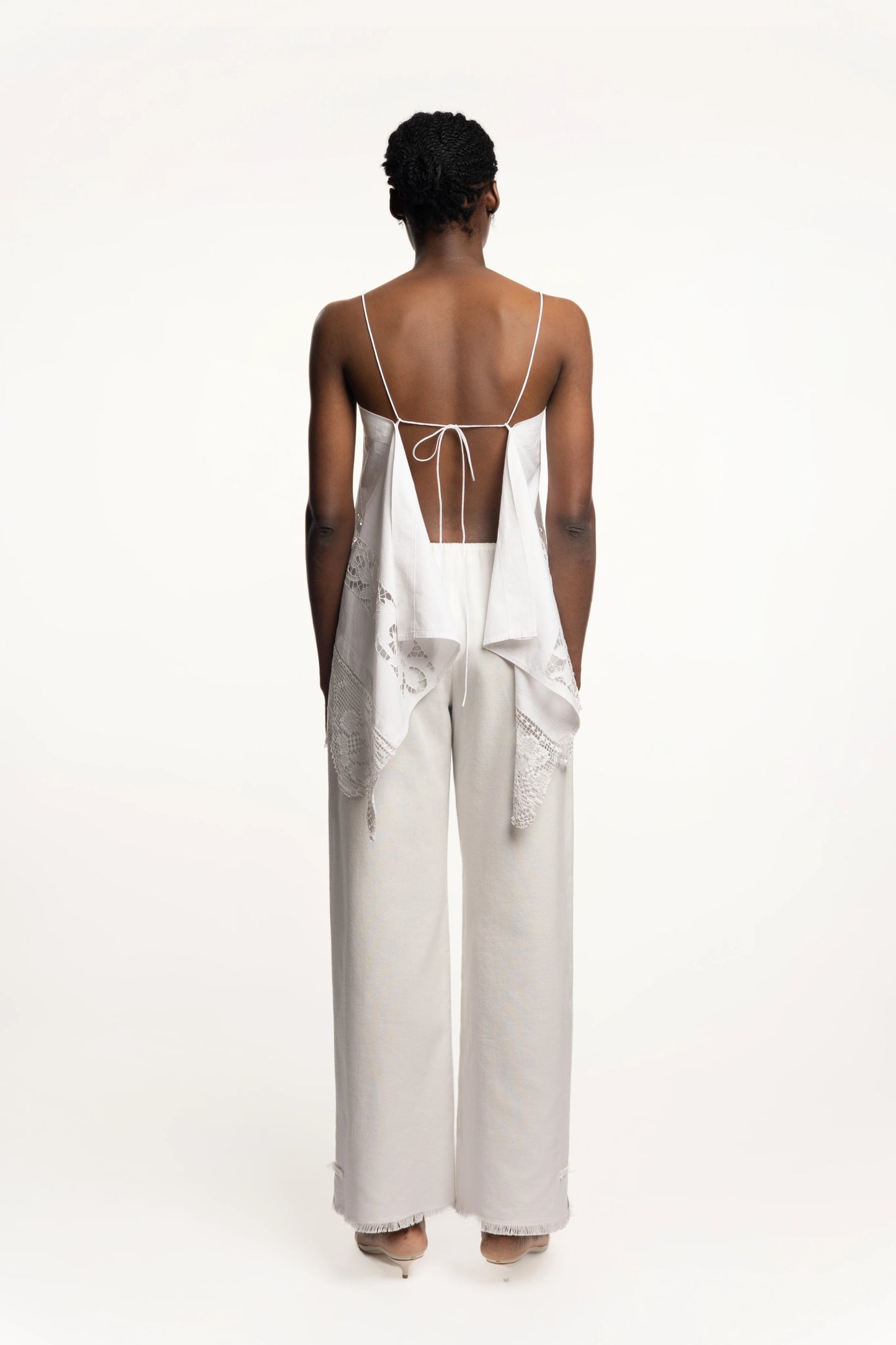 Cruise Trousers | MAISON MAGDALNEA | White cotton trousers with a handmade frog button as decoration at the bottom | Full model picture back view