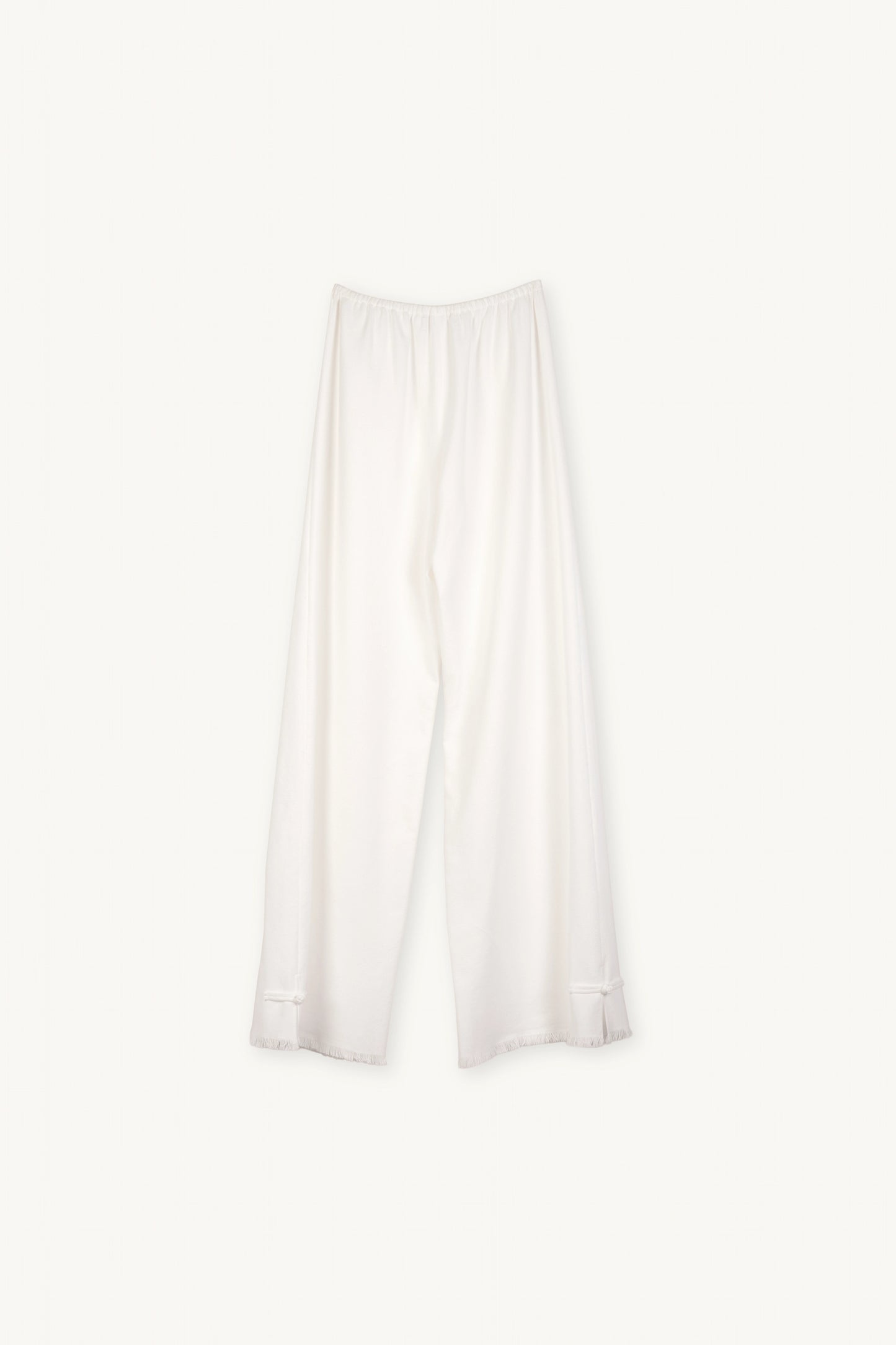 Cruise Trousers | MAISON MAGDALNEA | White cotton trousers with a handmade frog button as decoration at the bottom | Full product picture back view on light background