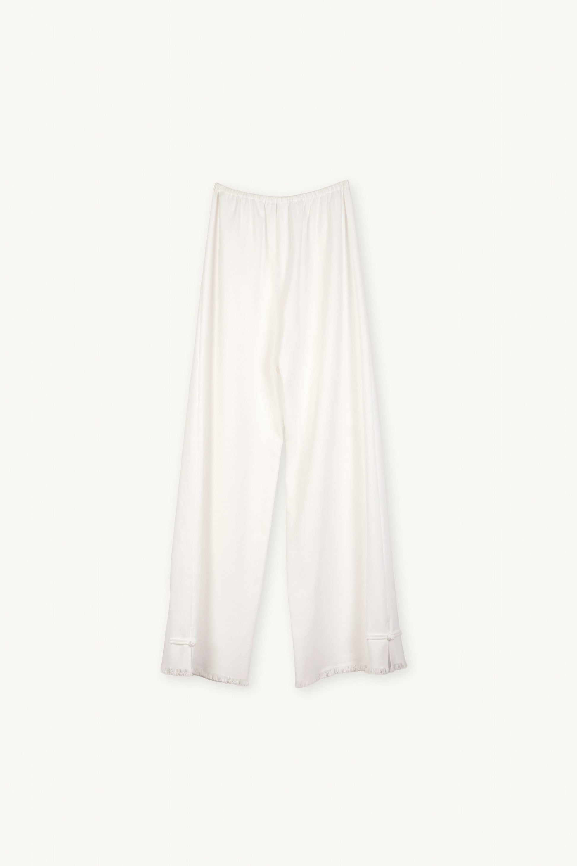 Cruise Trousers | MAISON MAGDALNEA | White cotton trousers with a handmade frog button as decoration at the bottom | Full product picture back view on light background