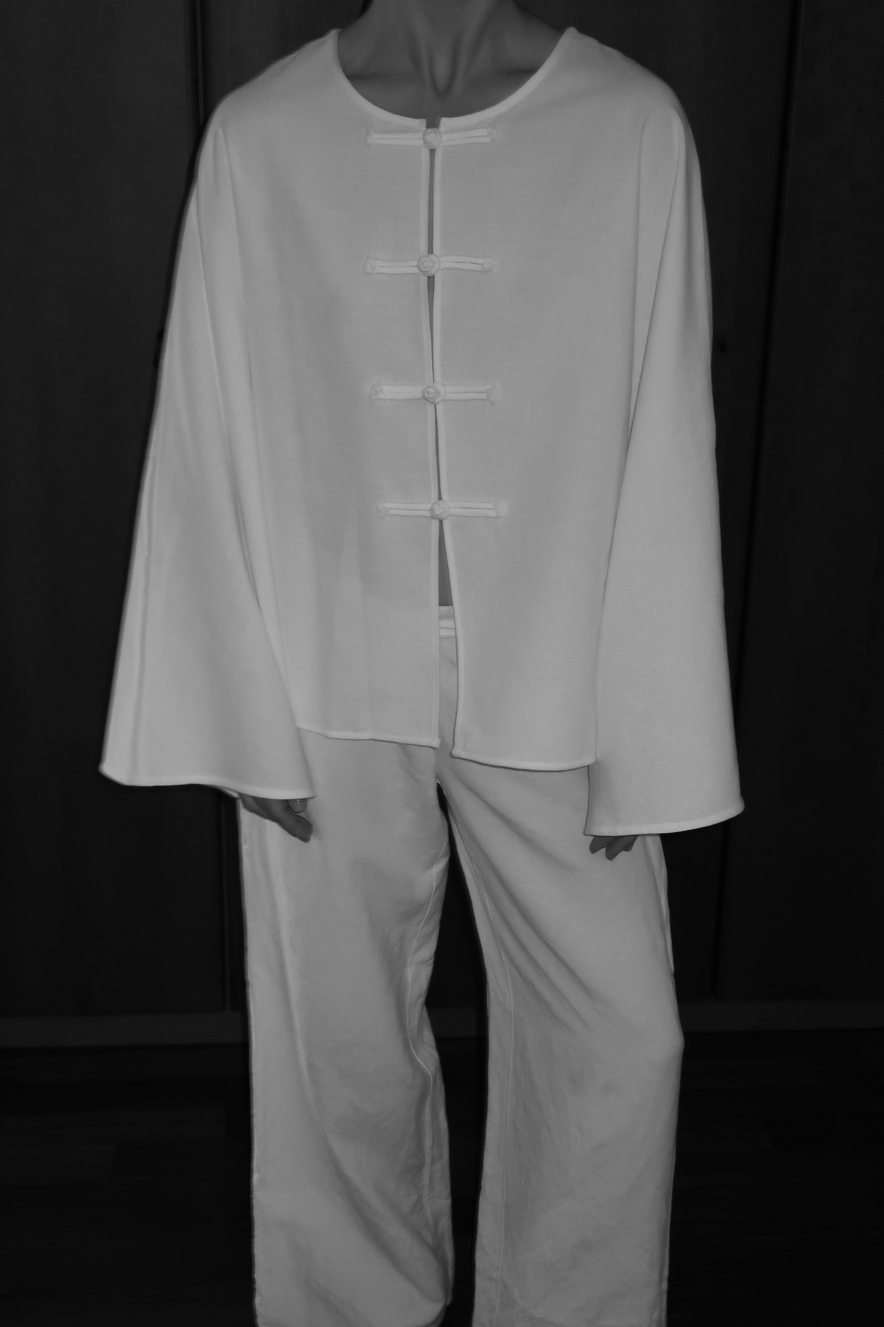 MAISON MAGDALENA Model wearing Cruise Top and Cruise Trousers on a black background