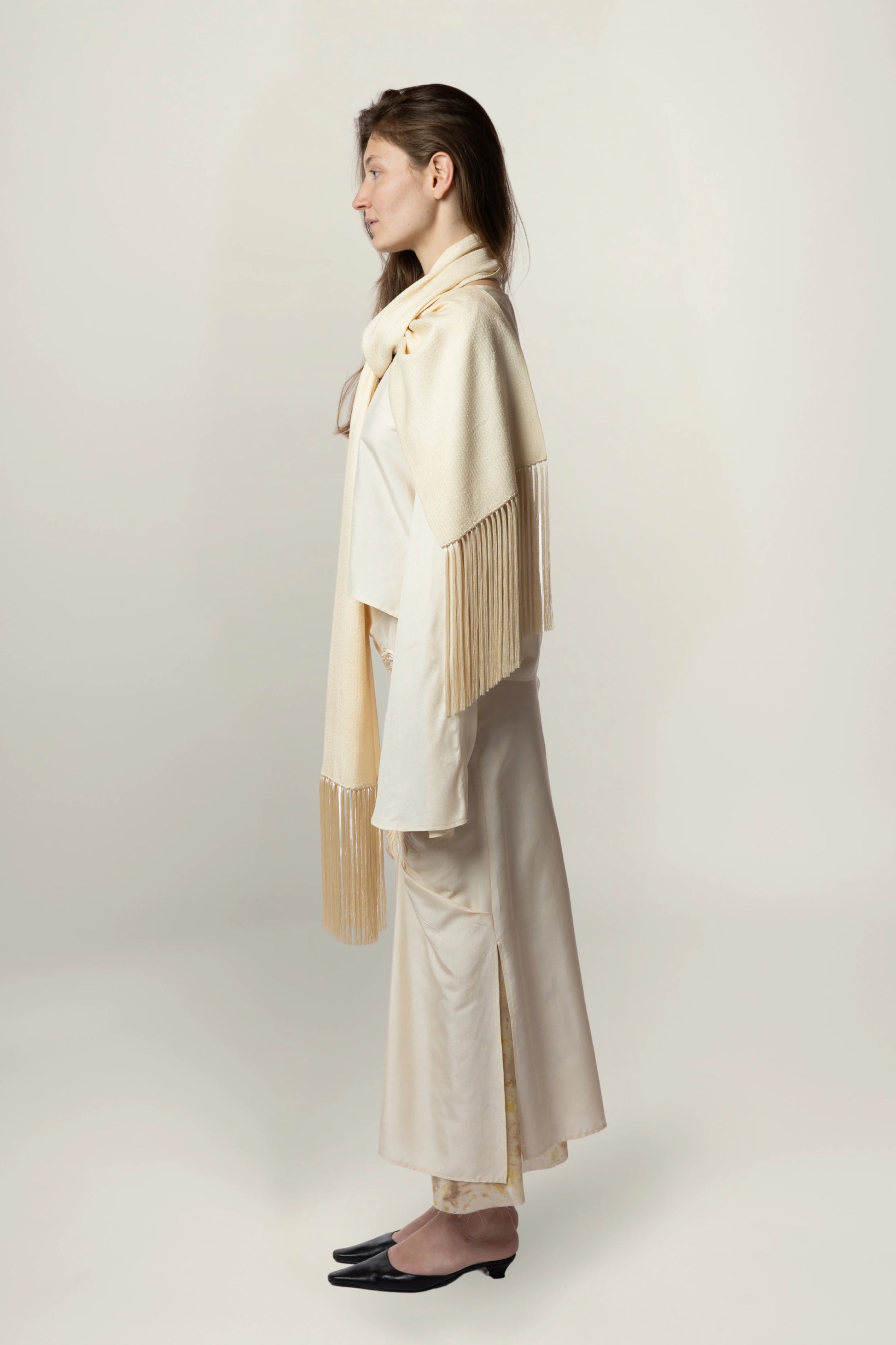 Linea Scarf | MAISON MAGDALENA | A beige long scarf with a handmade fringed finish | Model picture