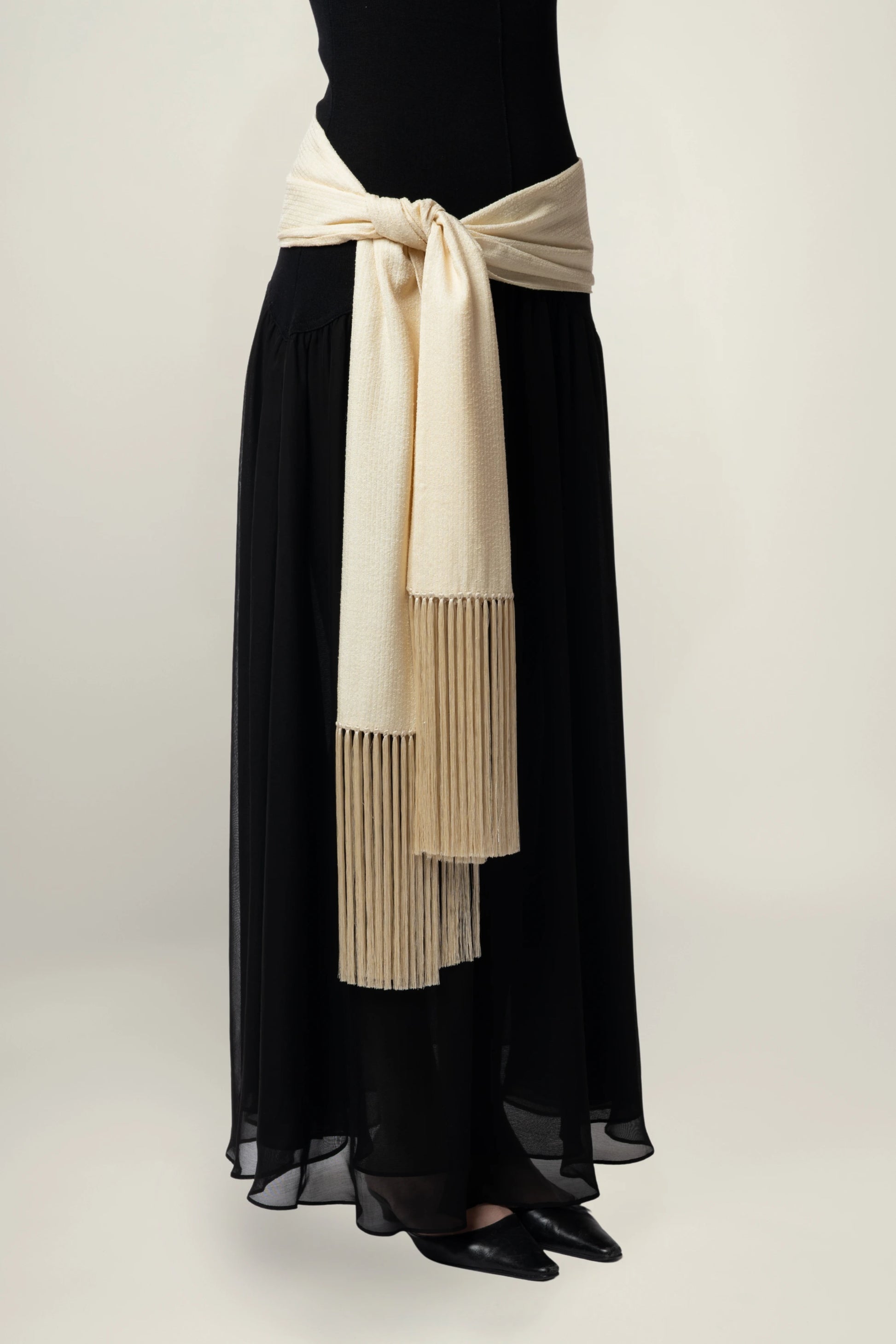 Linea Scarf | MAISON MAGDALENA | A beige long scarf with a handmade fringed finish | Product picture