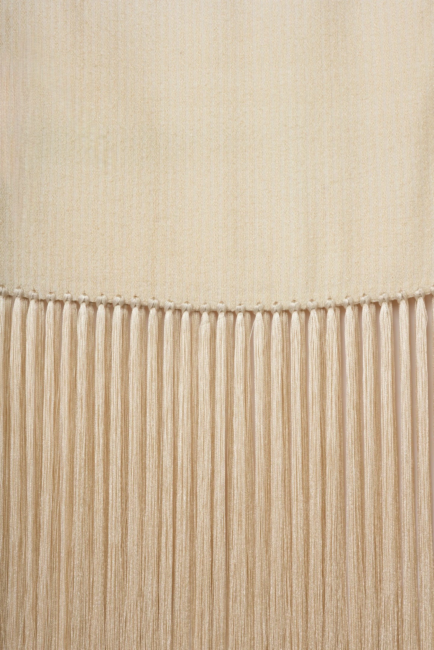 Linea Scarf | MAISON MAGDALENA | A beige long scarf with a handmade fringed finish | Detail picture