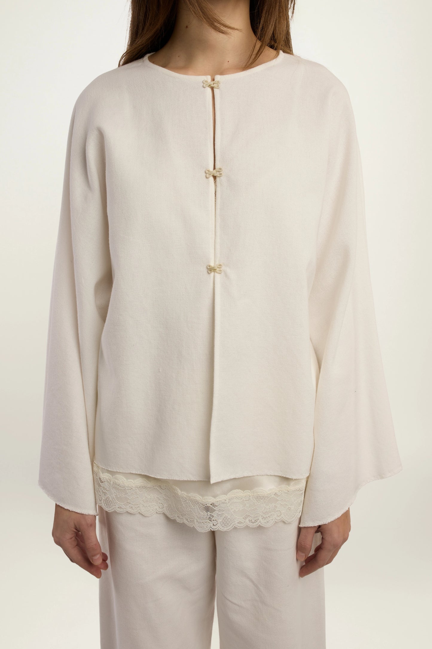 Cruise Top | MAISON MAGDALENA | White top with four hook and eye closures | Model picture front view close up