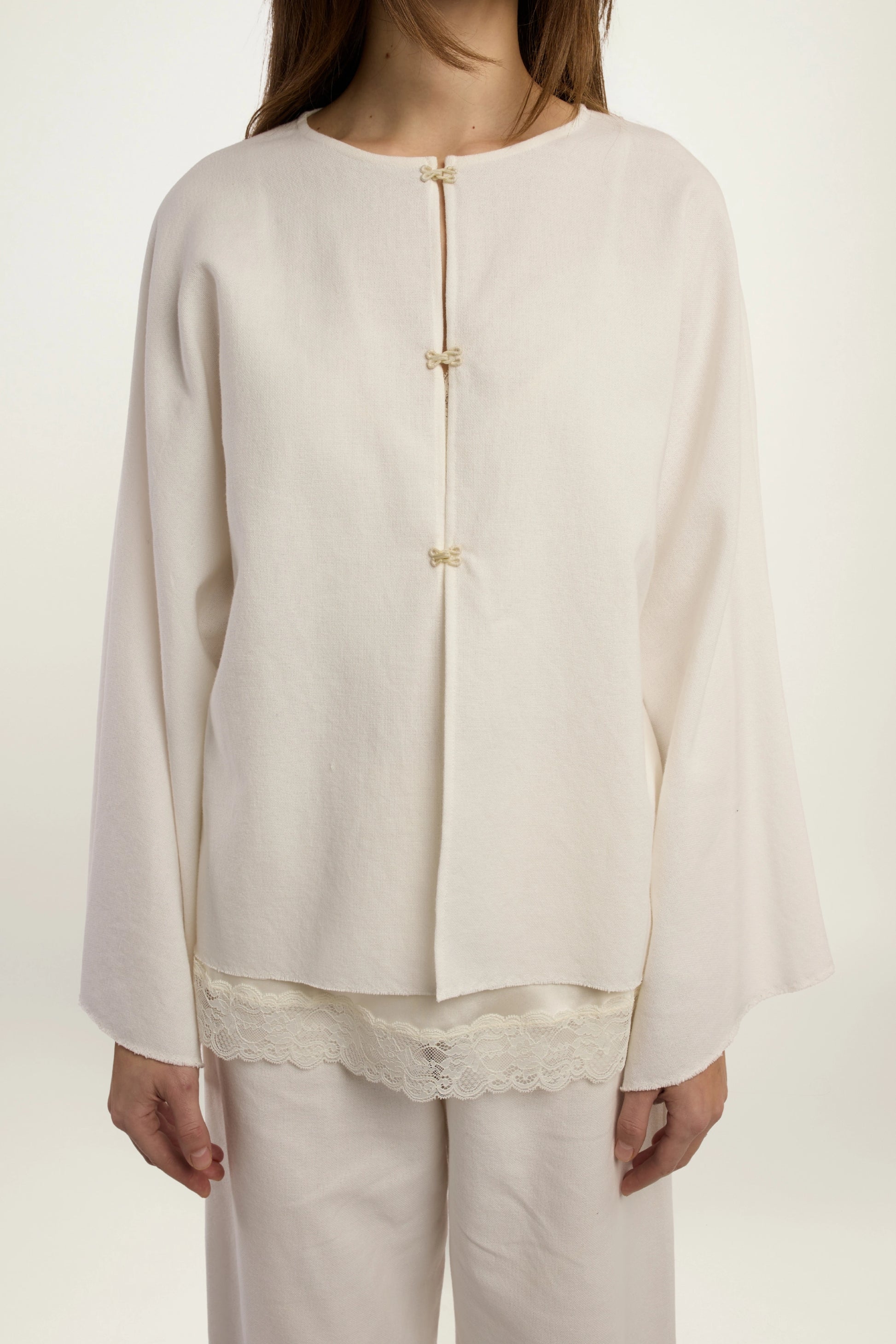 Cruise Top | MAISON MAGDALENA | White top with four hook and eye closures | Model picture front view close up
