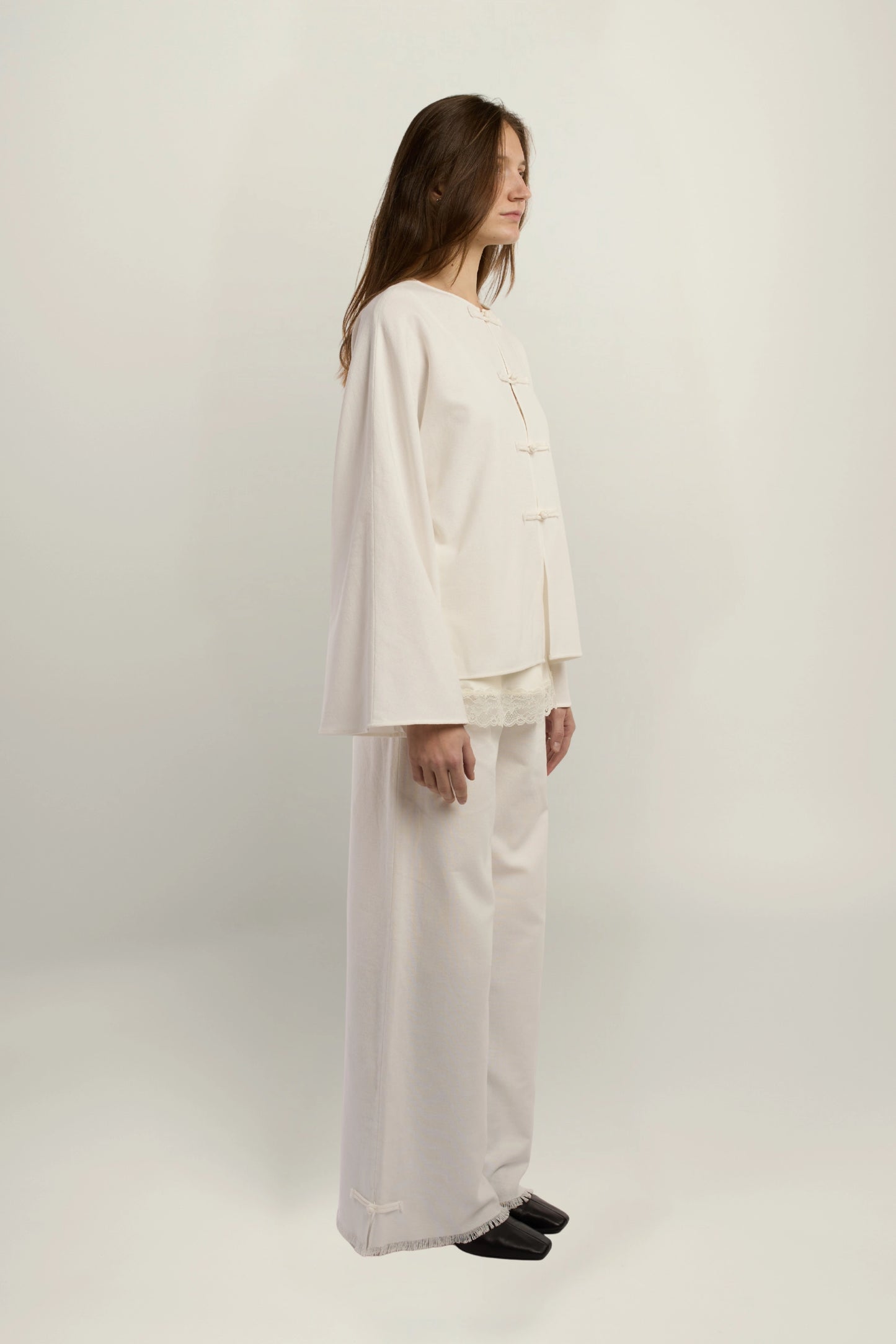 Cruise Top | MAISON MAGDALENA | White top with handmade frog buttons | Model picture lateral view