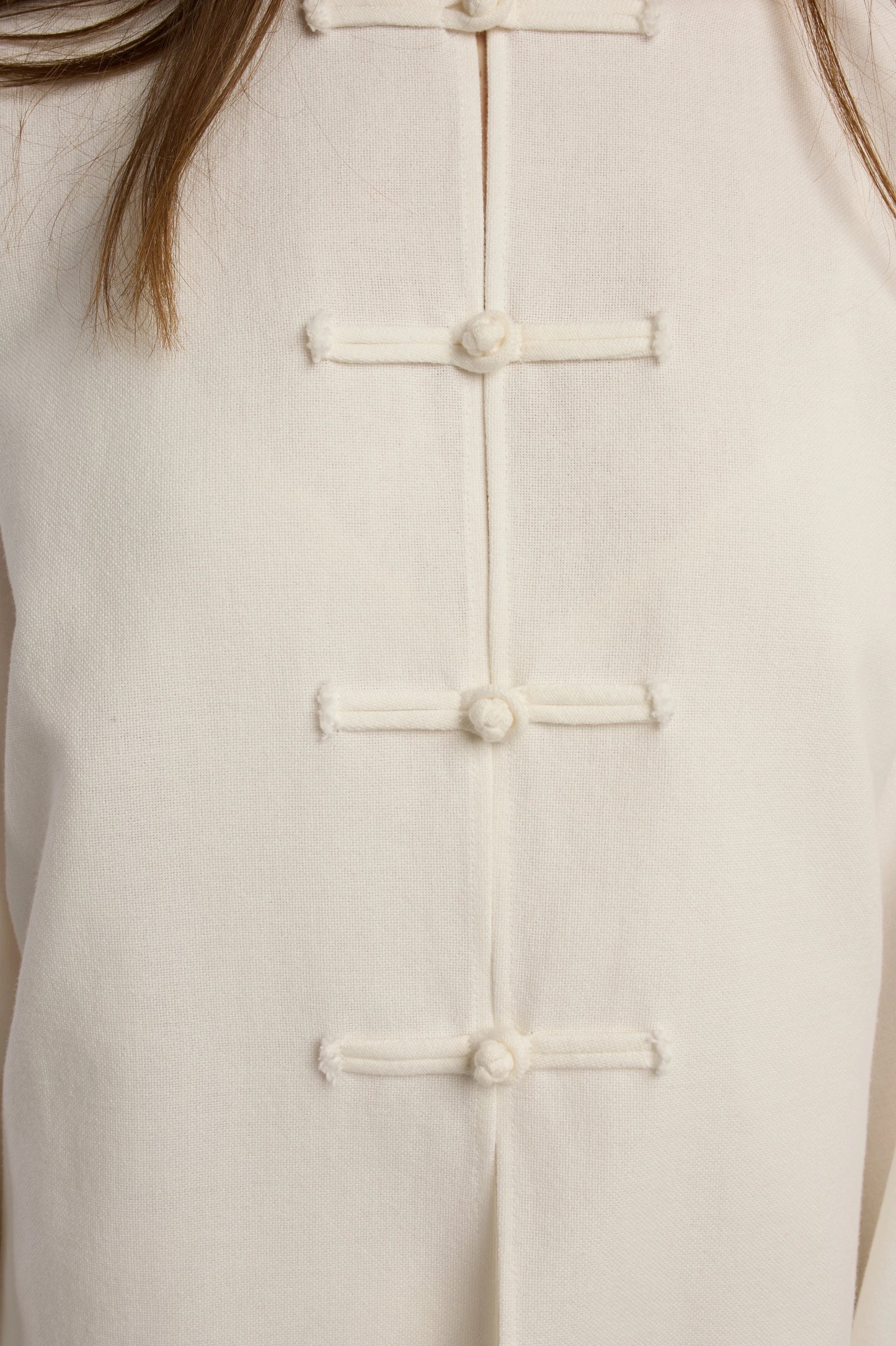 Cruise Top | MAISON MAGDALENA | White top with handmade frog buttons | Model picture button close up