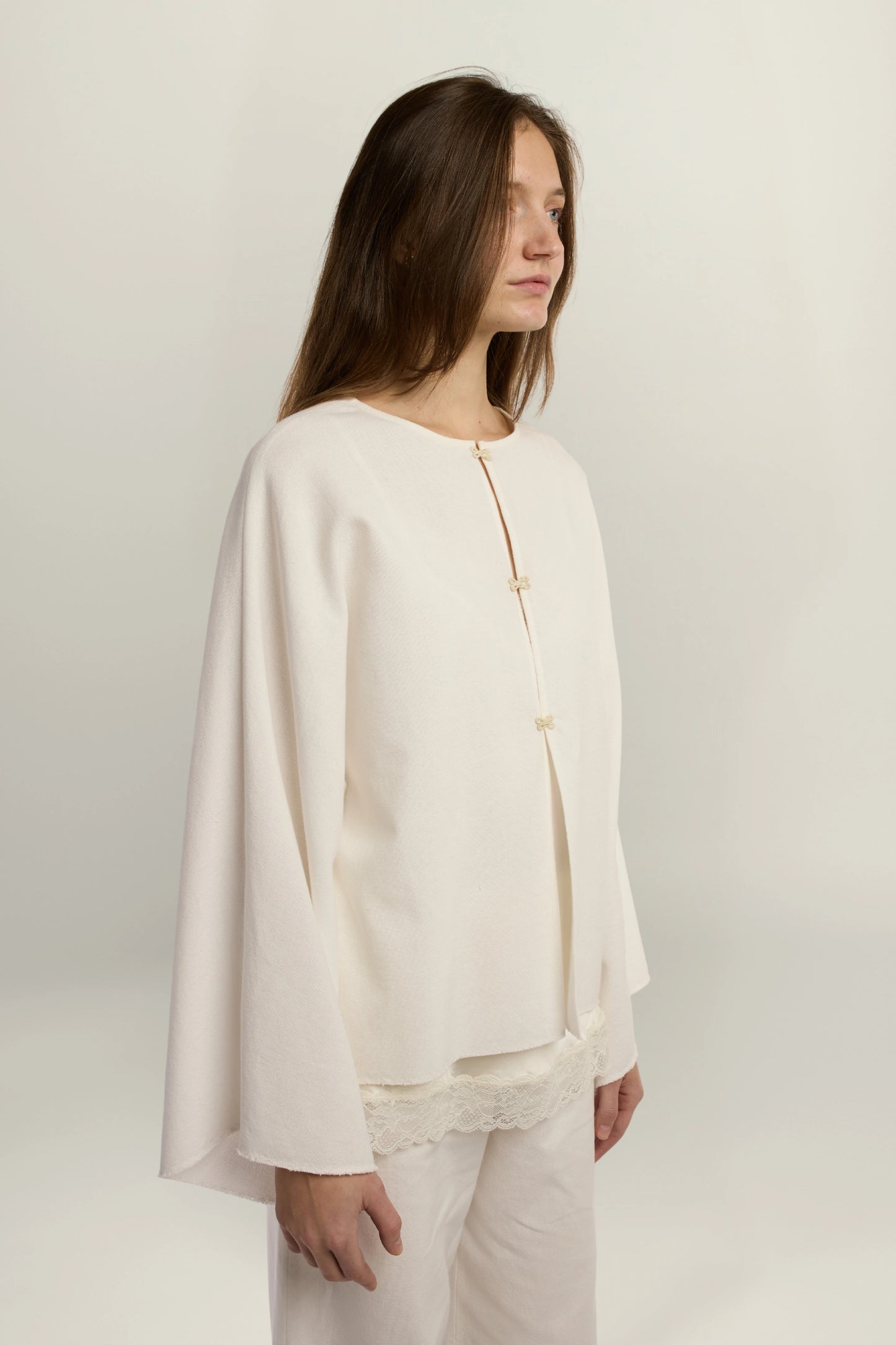 Cruise Top | MAISON MAGDALENA | White top with four hook and eye closures | Model picture lateral view