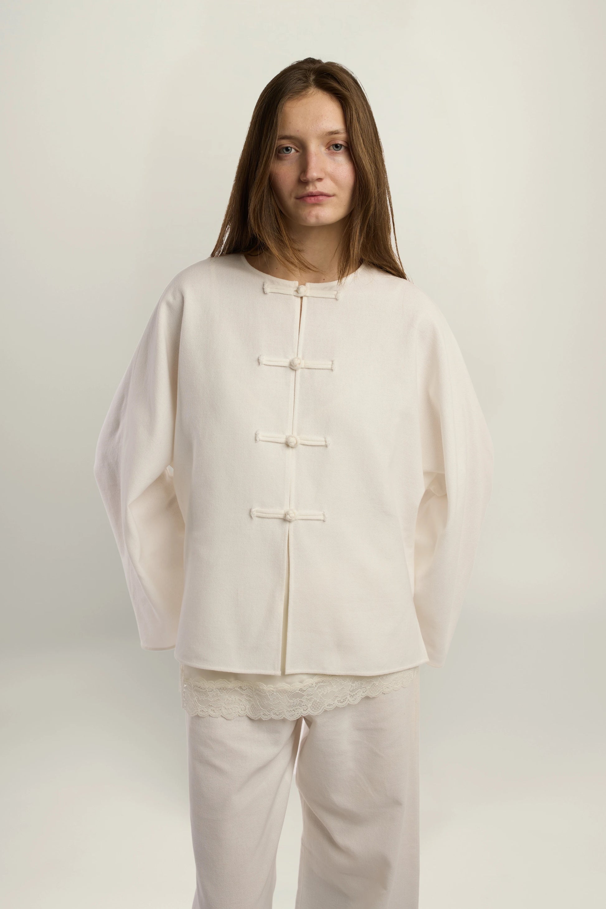 Cruise Top | MAISON MAGDALENA | White top with handmade frog buttons | Model picture front view